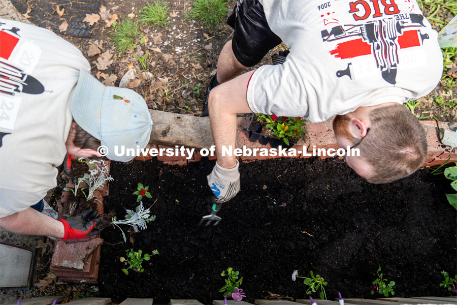 Tyson Shields (left) and Samuel Ingledue (right), members of Delta Phi Fraternity go to work at planting a fairy garden during the Big Event. May 4, 2024. Photo by Kirk Rangel for University Communication.